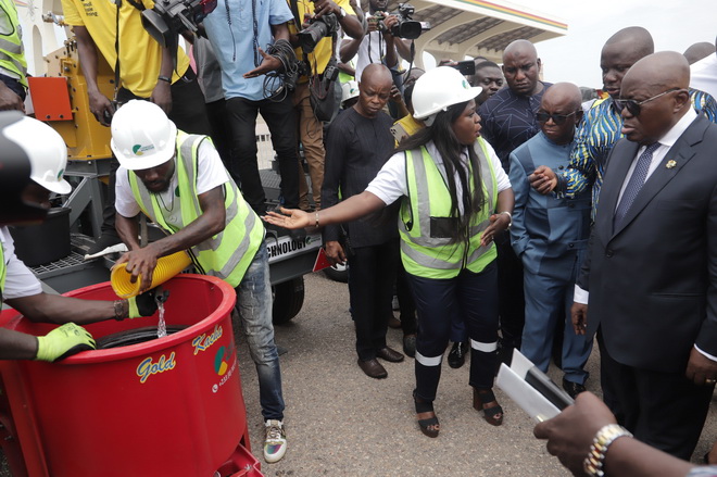 President Akufo-Addo and other officials at the event being introduced to the workings of the new equipment